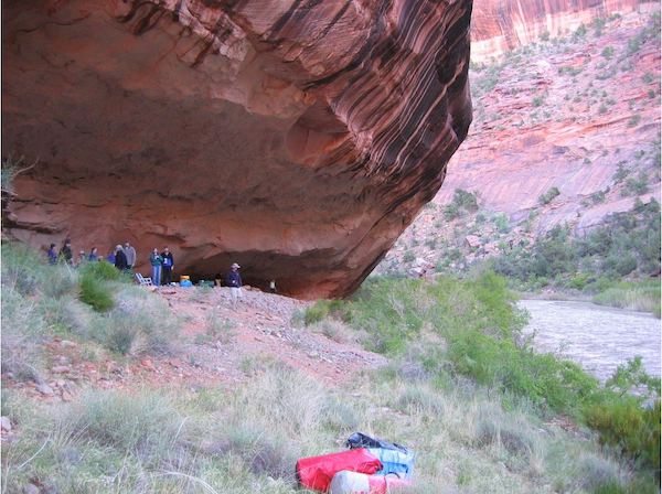 DRAMS team members looking at petroglyphs along the river.