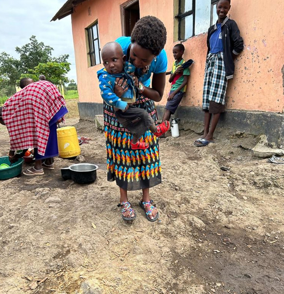 A woman holding a child